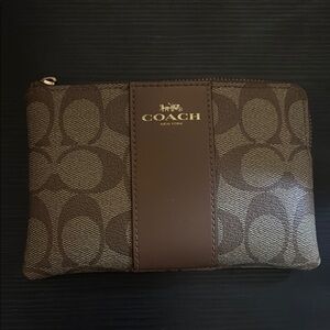 Coach wristlet. Zipper works the zipper pull has fallen off.